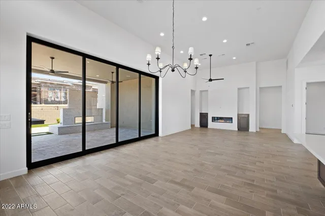 a view of an empty room with a fireplace