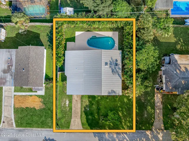 a view of swimming pool with seating space