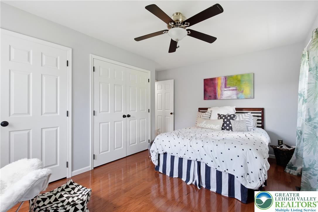890 Lahr Road Nazareth, PA 18064 - Photo 26 of 71 Hardwood flooring flows throughout this naturally illuminated sleeping space, offering an ideal haven for repose.