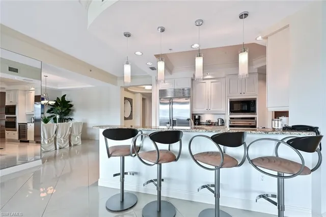 a dining room with furniture and a fireplace