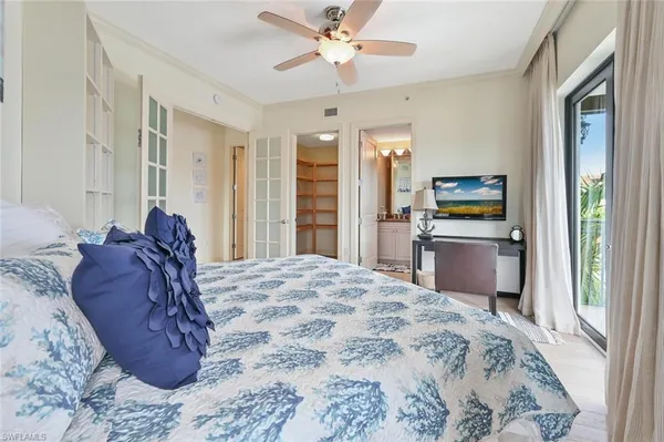 a bedroom with a large bed and a window