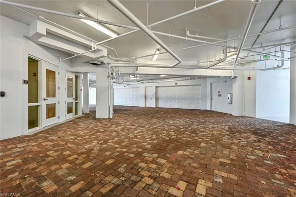 a view of a hallway with a refrigerator