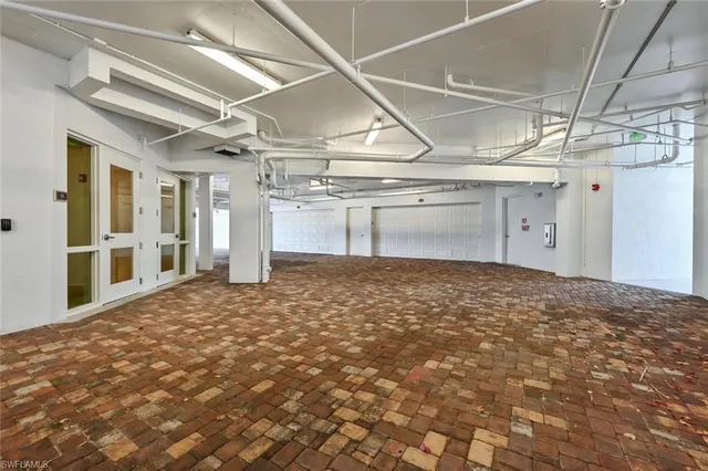 a view of a hallway with a refrigerator