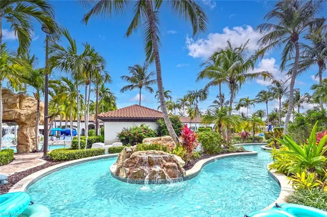 a view of a swimming pool with lounge chairs