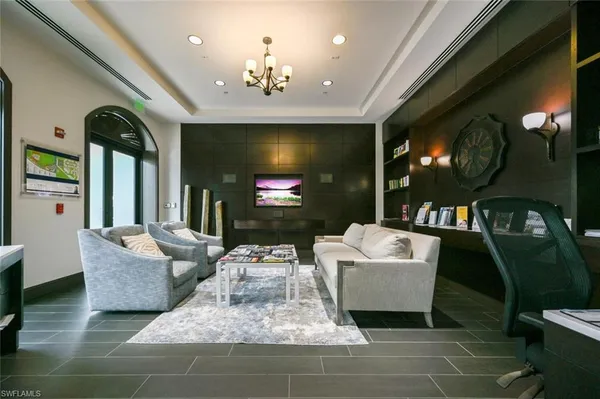 a front view of a building with a garden