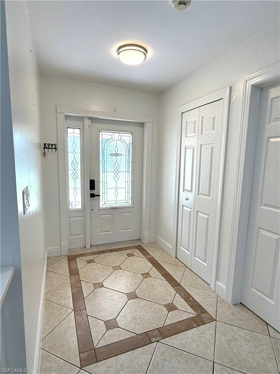 1964 42nd Street Southwest Naples, FL 34116 - Photo 4 of 25 a view of a livingroom with wooden floor and a window