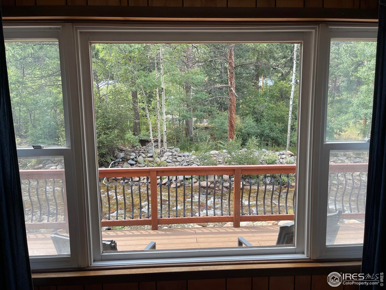 664 Riverside Drive Lyons, CO 80540 - Photo 12 of 16 a view of a house that has a windows