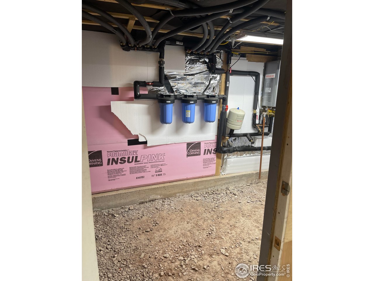 664 Riverside Drive Lyons, CO 80540 - Photo 13 of 16 a water heater on the wall