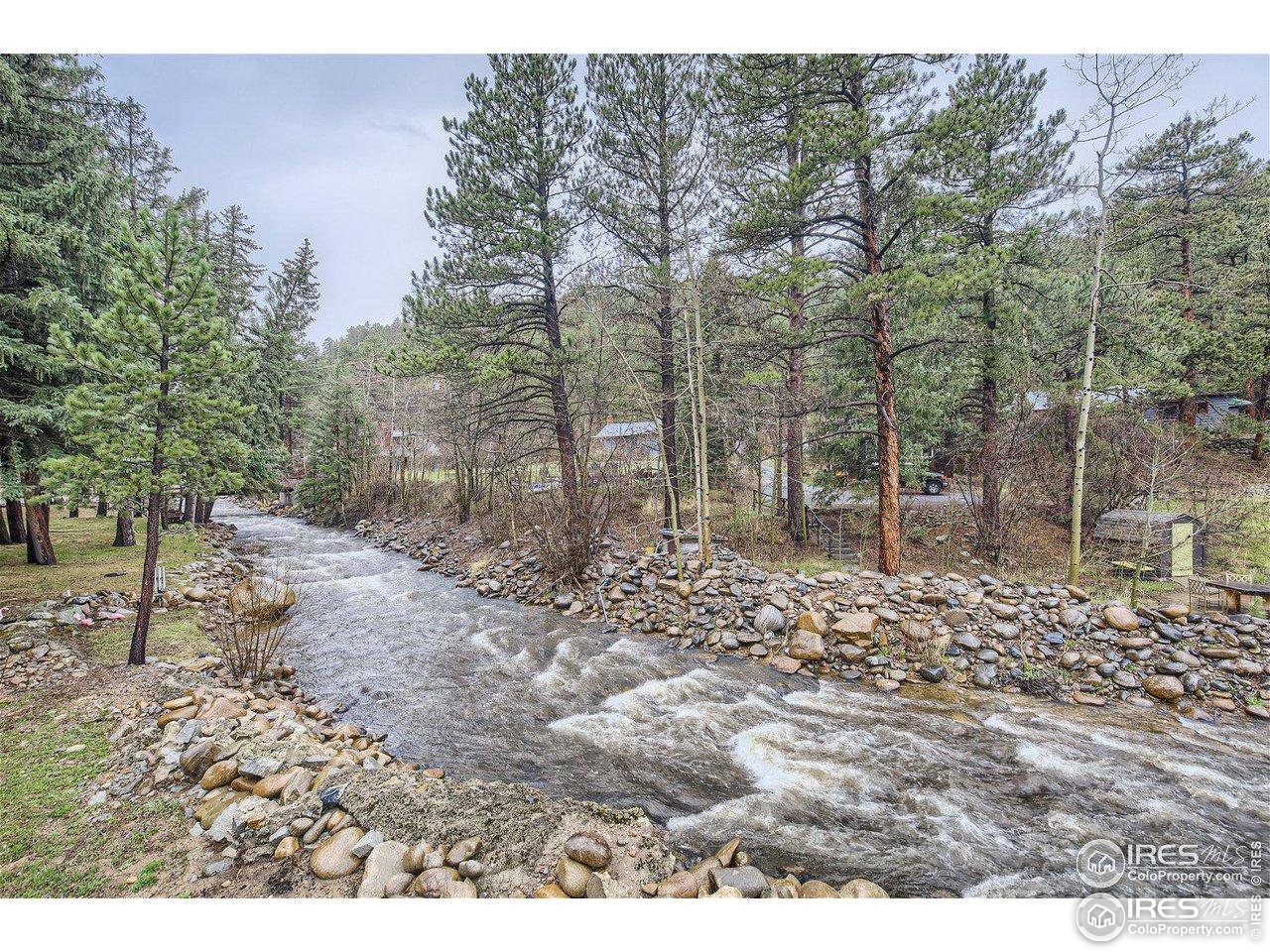 664 Riverside Drive Lyons, CO 80540 - Photo 2 of 16 a view of a yard with lots of green space