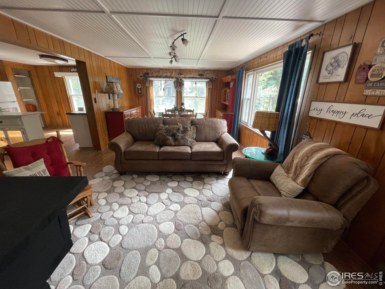664 Riverside Drive Lyons, CO 80540 - Photo 7 of 16 a living room with furniture and a large window