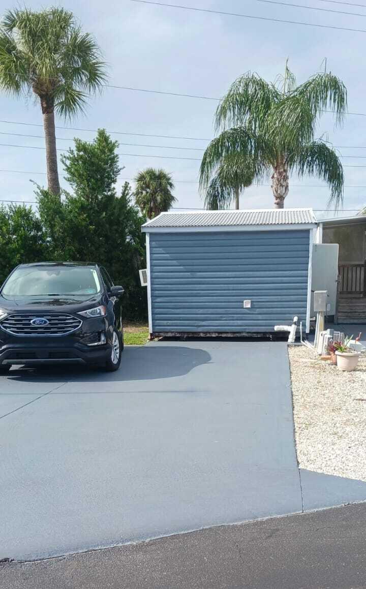 a view of a car parked in front of a house