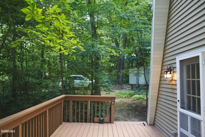 33 Galena Ridge Drive Stockton, IL 61085 - Photo 17 of 23 a balcony with wooden floor and yard in the back