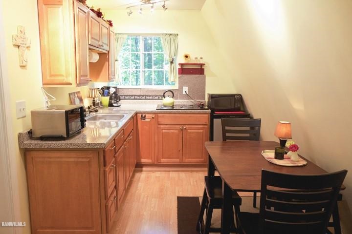 33 Galena Ridge Drive Stockton, IL 61085 - Photo 2 of 23 a kitchen with a stove a sink and a refrigerator