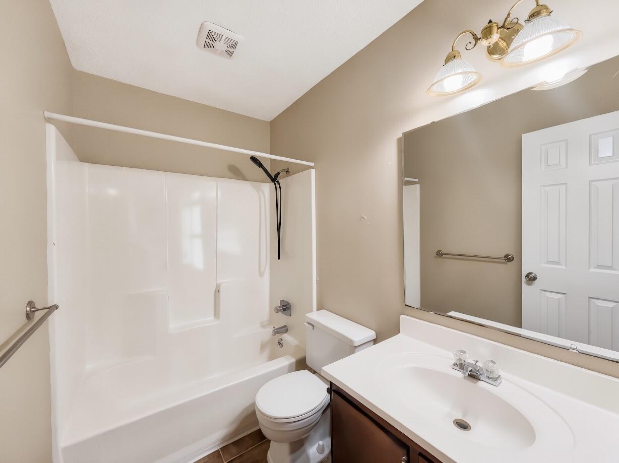 208 Squirrel Haven Road, Unit A Mary Esther, FL 32569 - Photo 12 of 16 a bathroom with a sink a toilet and shower