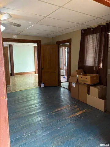 a view of kitchen with furniture and large window