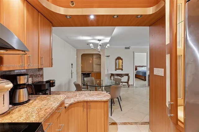 a living room with granite countertop furniture and fireplace
