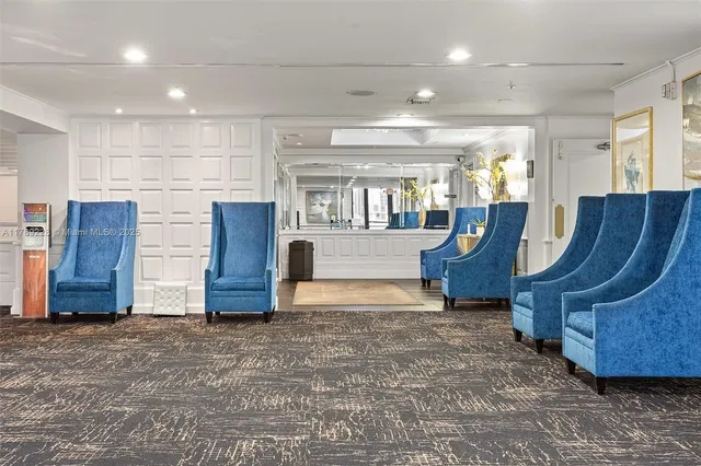 a view of kitchen with furniture and windows