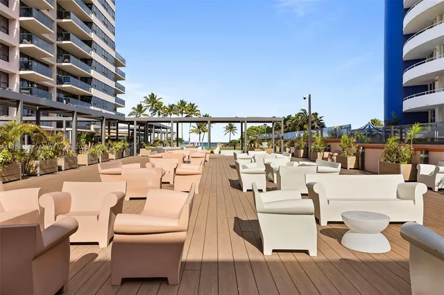 a view of roof deck with patio