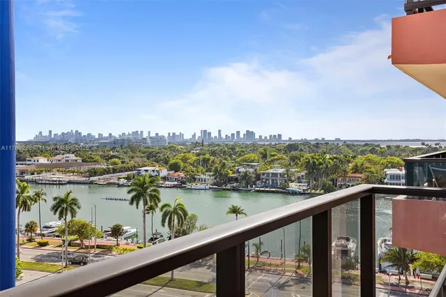 a view of a lake with a city skyline in the background