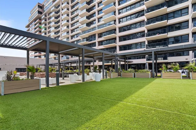 a view of an chairs and table in the patio