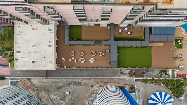 a view of swimming pool with a lounge chair