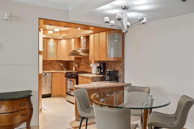 a kitchen with a table chairs stove and refrigerator