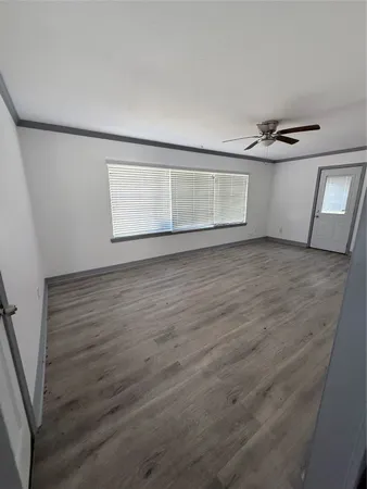 a view of an empty room with a window