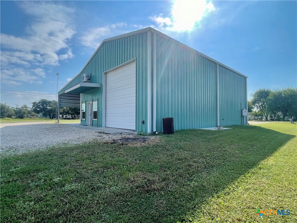 211 5th Street Port O'Connor, TX 77982 - Photo 20 of 22 a house view with backyard space