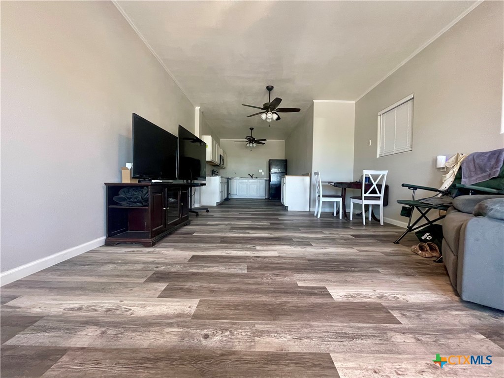 211 5th Street Port O'Connor, TX 77982 - Photo 4 of 22 a living room with furniture and a flat screen tv