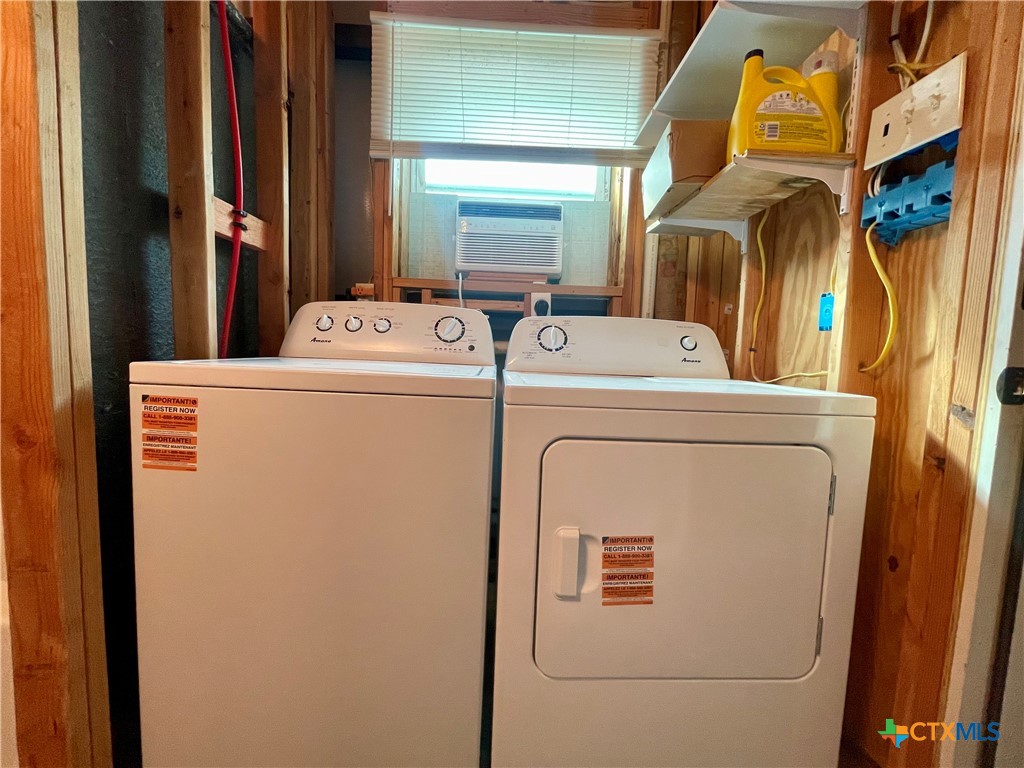 211 5th Street Port O'Connor, TX 77982 - Photo 7 of 22 a utility room with dryer and washer