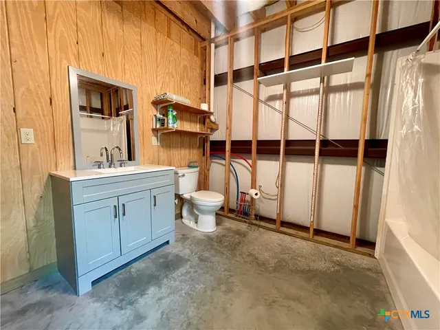 a view of a bathroom with a sink and mirror