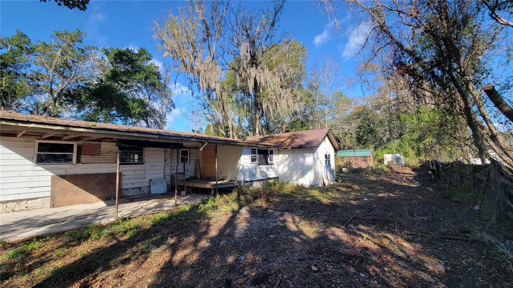 3911 Southeast 24th Street Ocala, FL 34471 - Photo 8 of 16 a view of a house with a yard