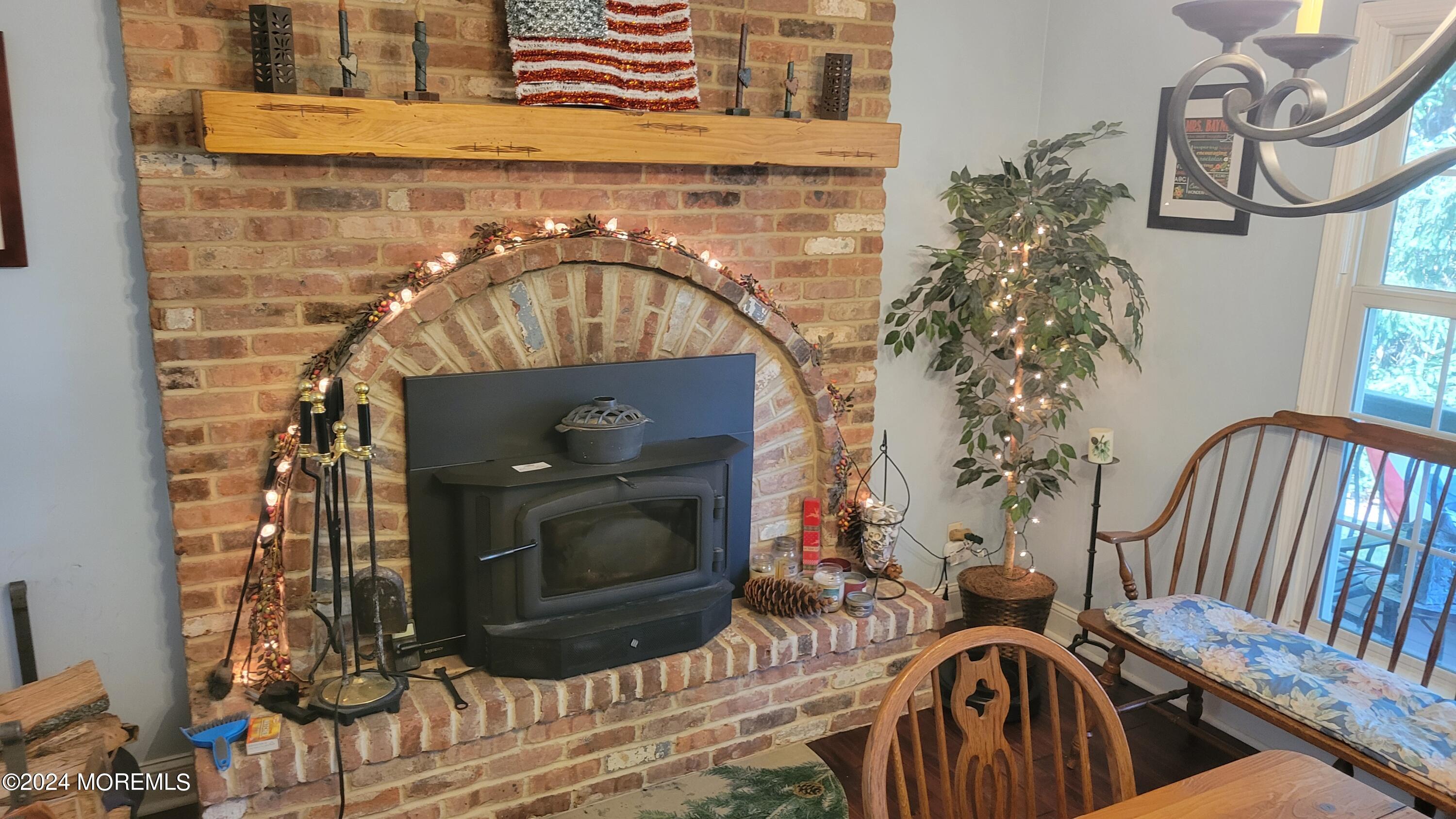 15 Bock Boulevard Howell, NJ 07731 - Photo 4 of 21 a living room with a fireplace and a potted plant