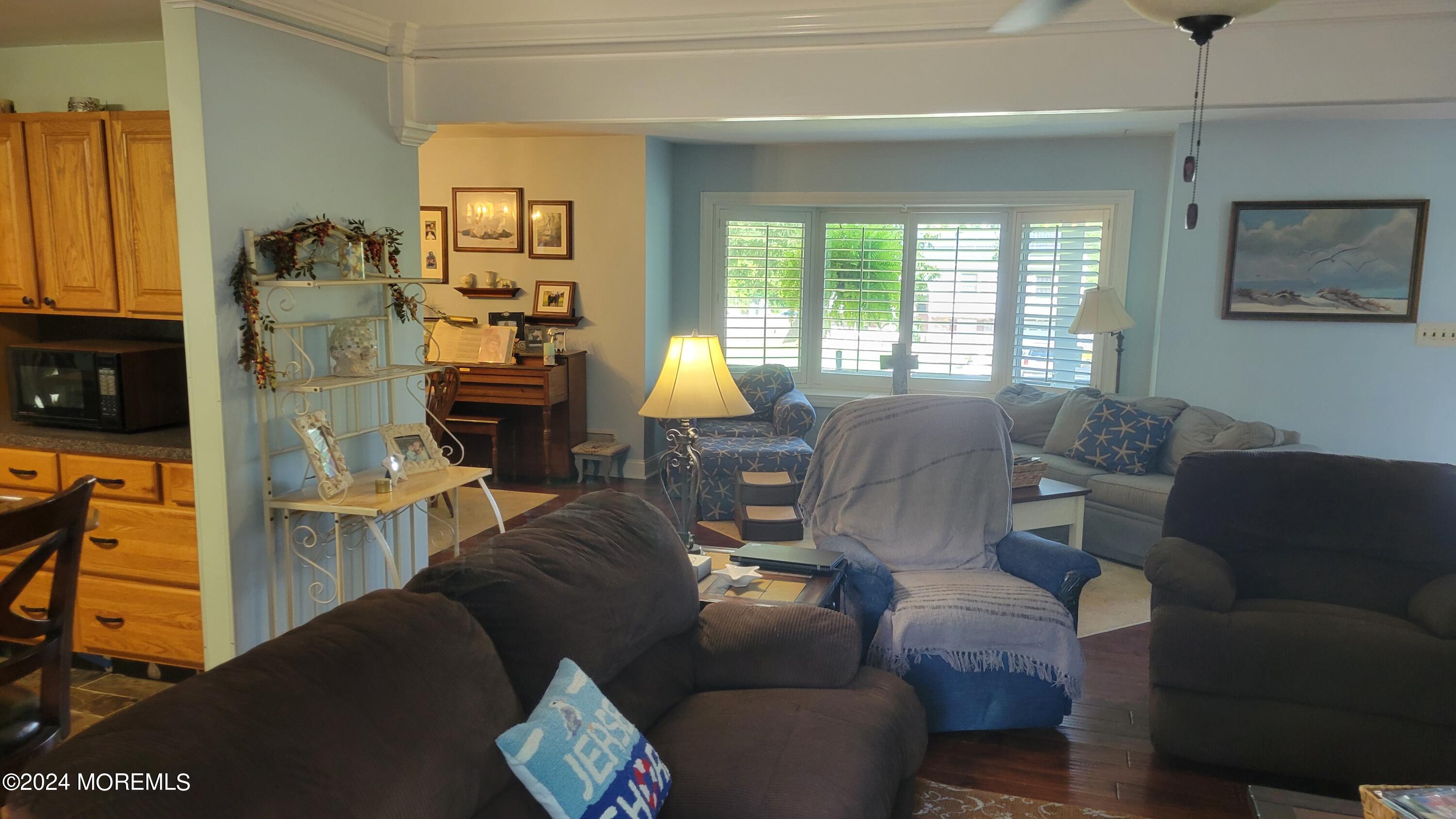 15 Bock Boulevard Howell, NJ 07731 - Photo 8 of 21 a living room with furniture and a fireplace
