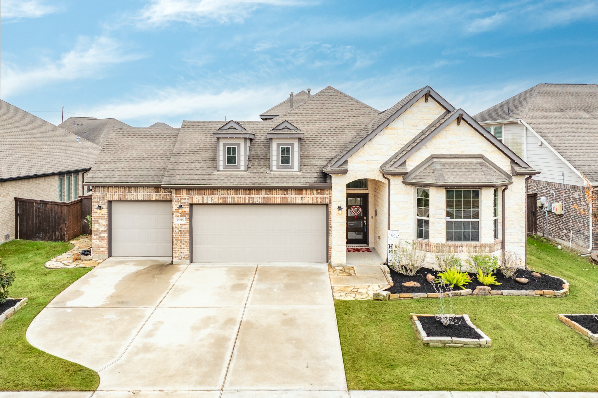 a front view of a house with swimming pool