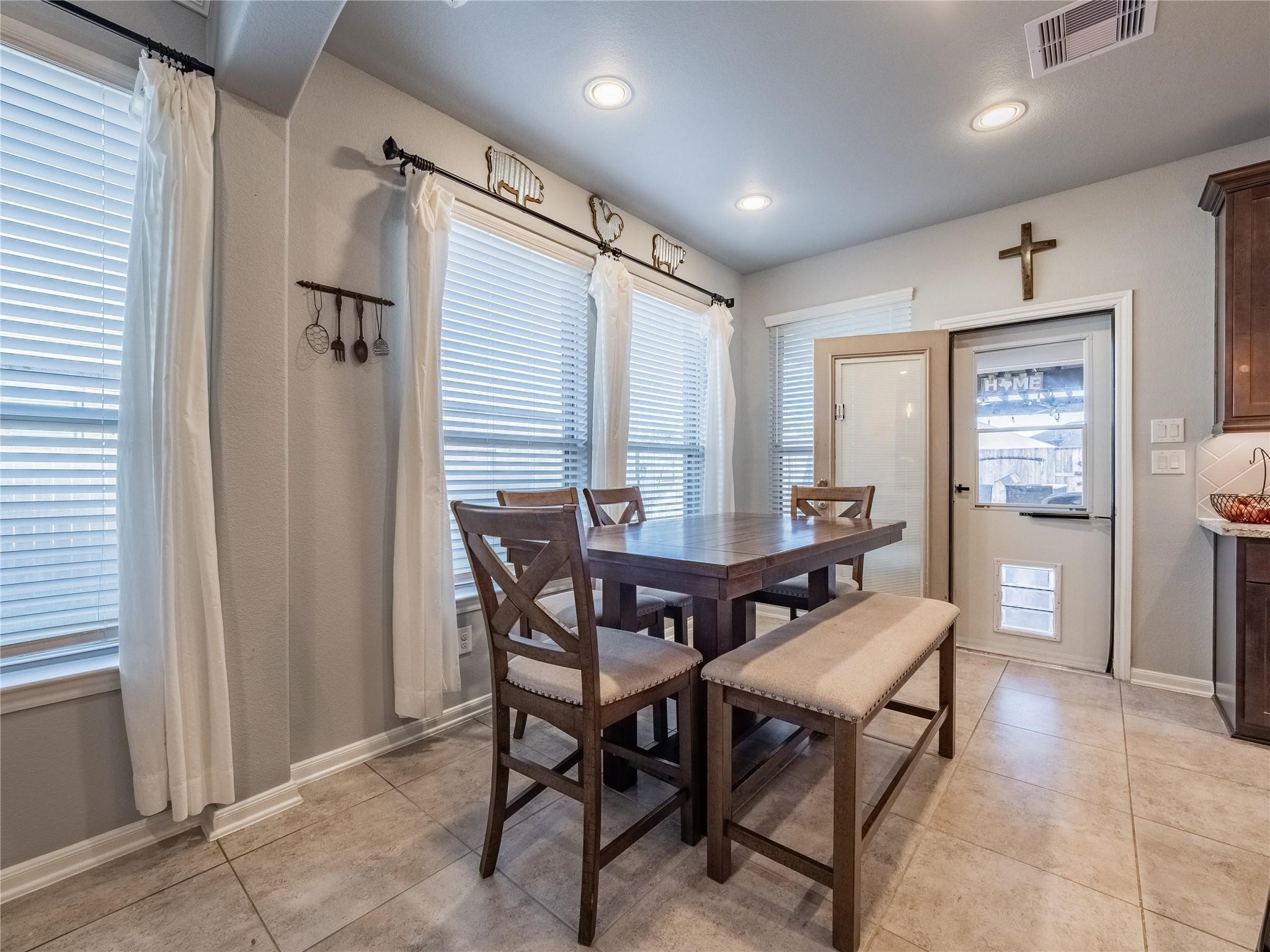 10215 Lewis Lane Iowa Colony, TX 77583 - Photo 21 of 45 a view of a dining room with furniture