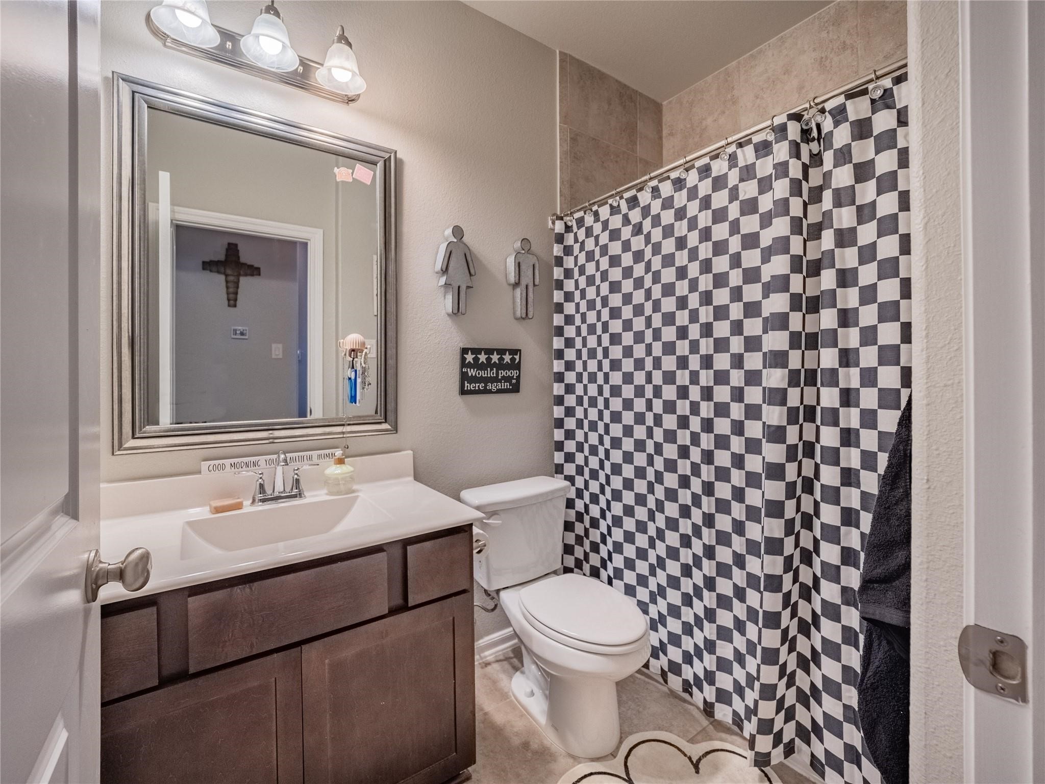 10215 Lewis Lane Iowa Colony, TX 77583 - Photo 28 of 45 Secondary bathroom shared between bedrooms two and three - shower/tub combination