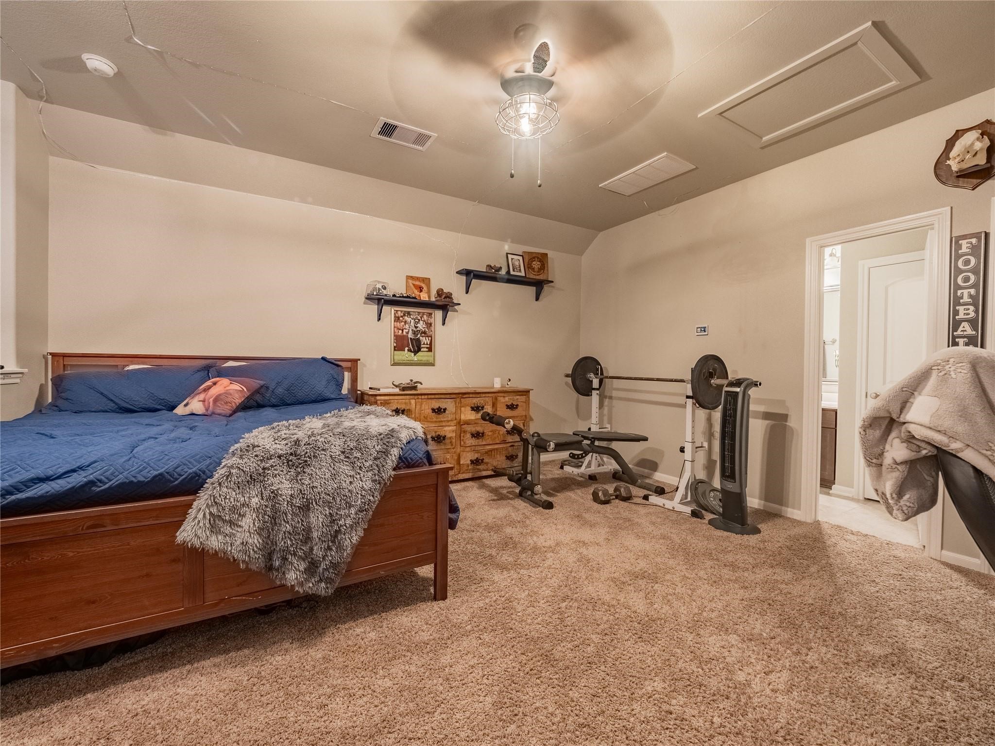 10215 Lewis Lane Iowa Colony, TX 77583 - Photo 29 of 45 Upstairs game/media room, currently functioning as a 4th bedroom, features a full bathroom and closet. This versatile space is ideal as a private retreat.