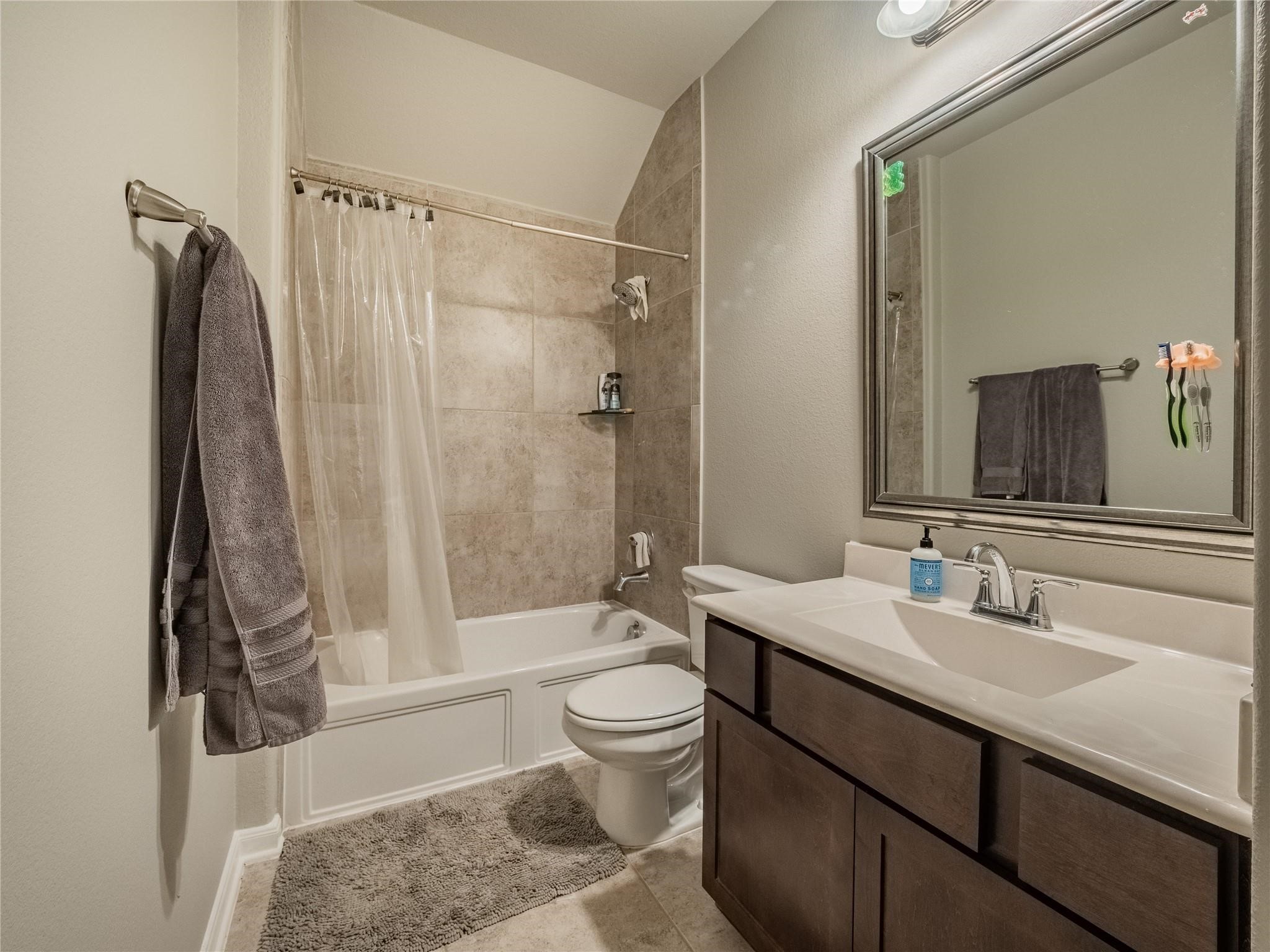 10215 Lewis Lane Iowa Colony, TX 77583 - Photo 31 of 45 Full bath serving the game/media room; features a shower/tub combination.