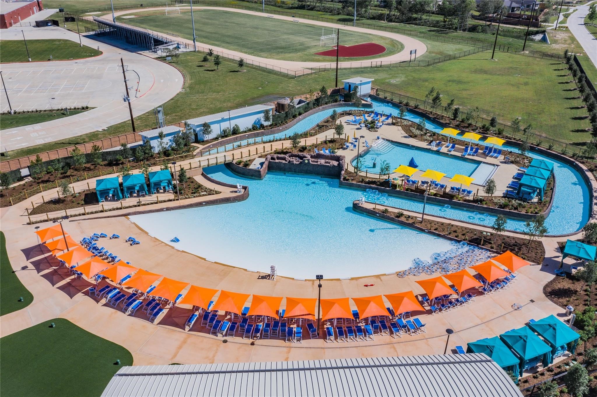 10215 Lewis Lane Iowa Colony, TX 77583 - Photo 35 of 45 View of wave pool, lazy river & family pool - middle school practice field visible in background.