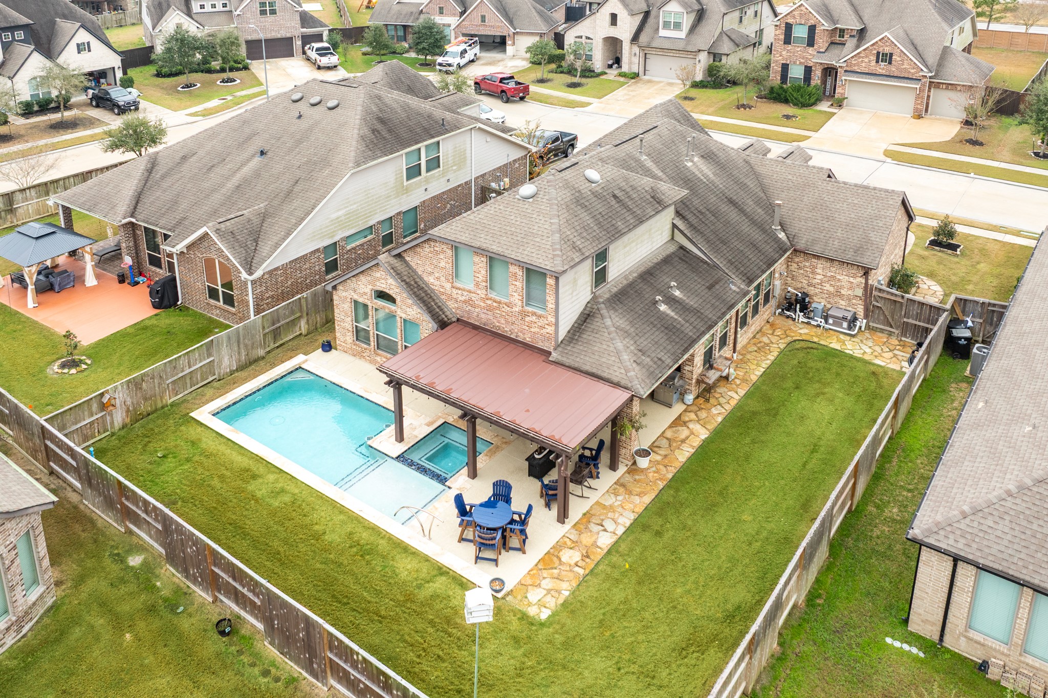 10215 Lewis Lane Iowa Colony, TX 77583 - Photo 4 of 45 an aerial view of a house with a swimming pool