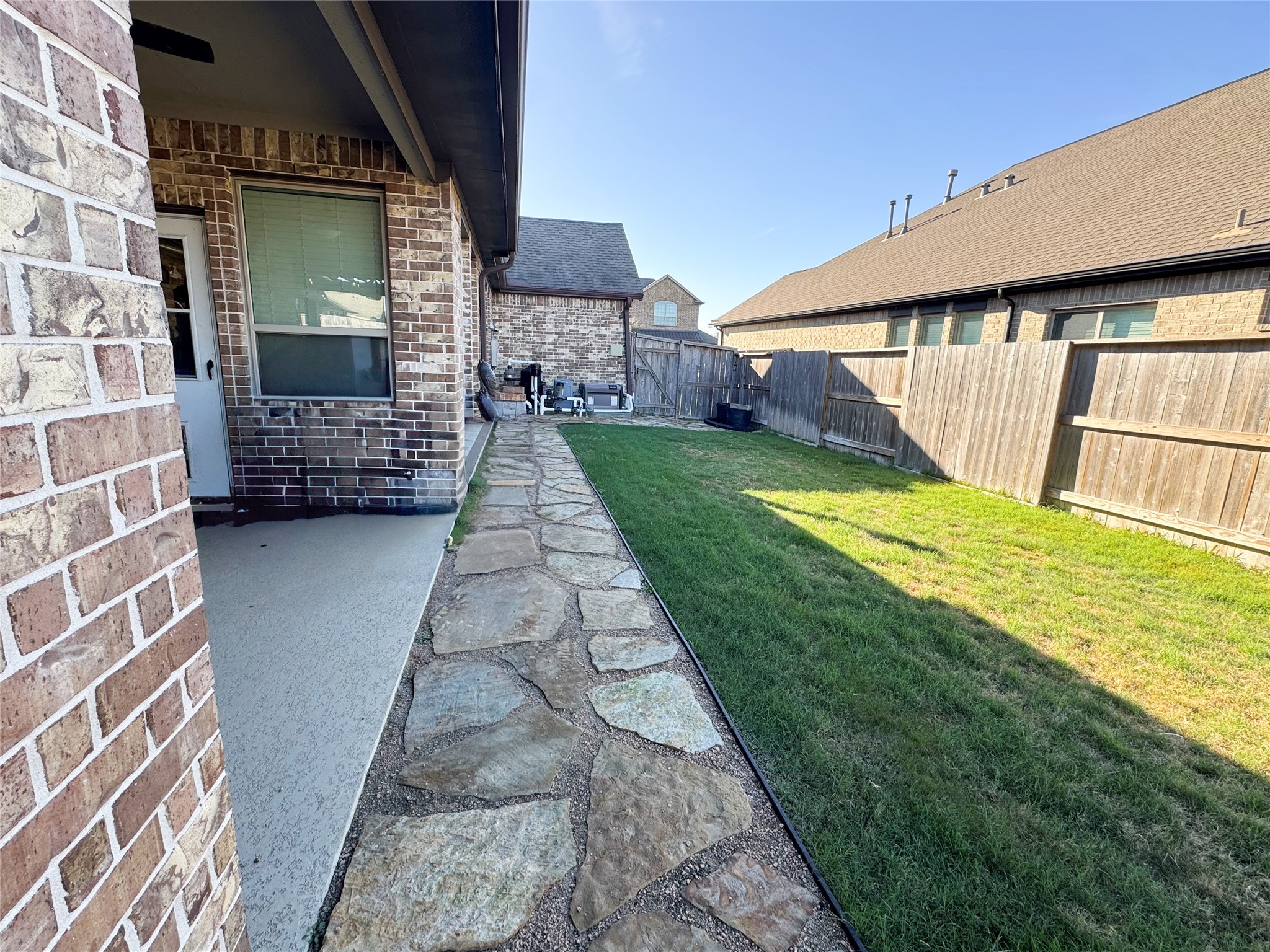 10215 Lewis Lane Iowa Colony, TX 77583 - Photo 8 of 45 a view of front door of house with yard