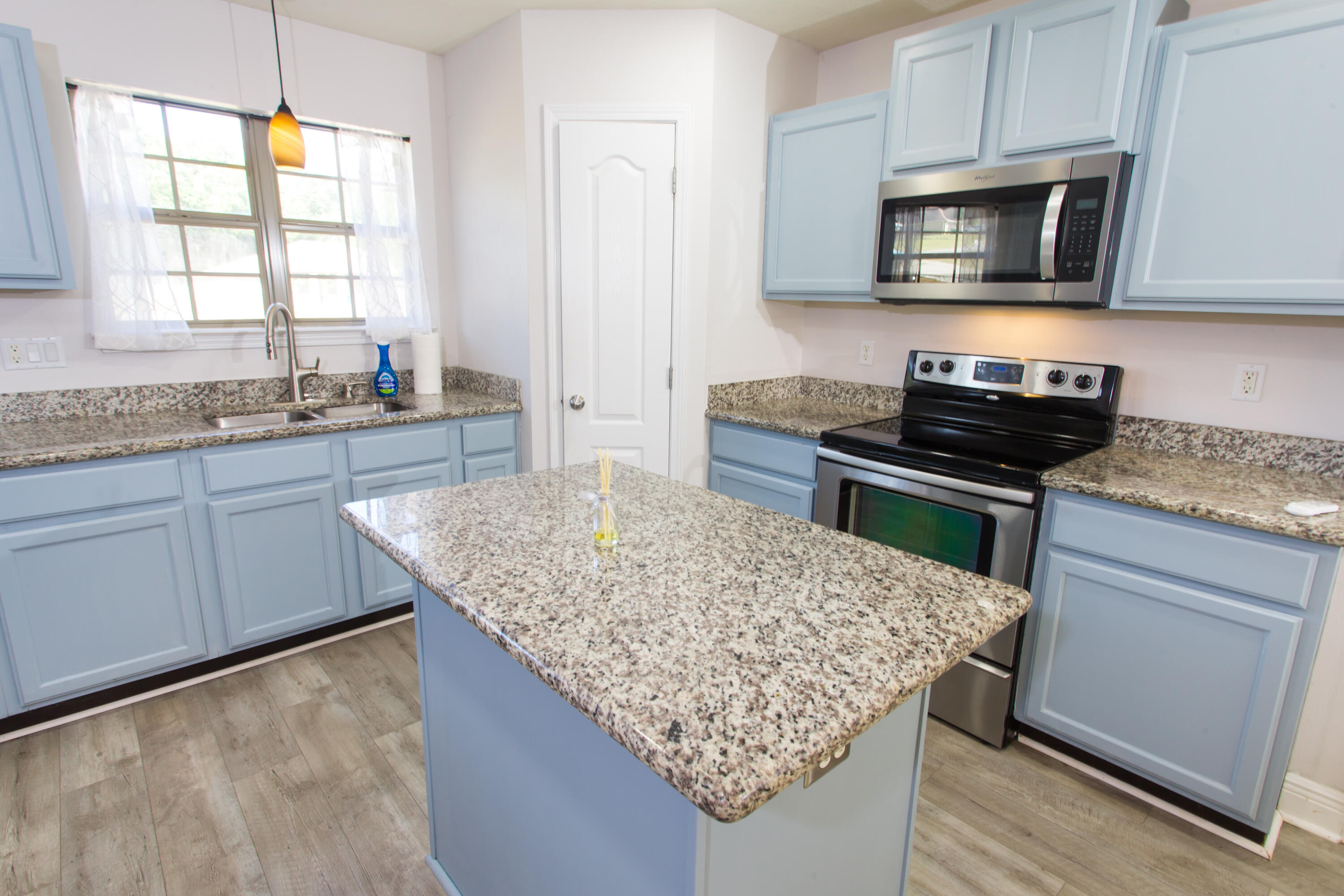 6229 Flash Lane Crestview, FL 32536 - Photo 11 of 51 a kitchen with stainless steel appliances granite countertop wooden cabinets and a stove