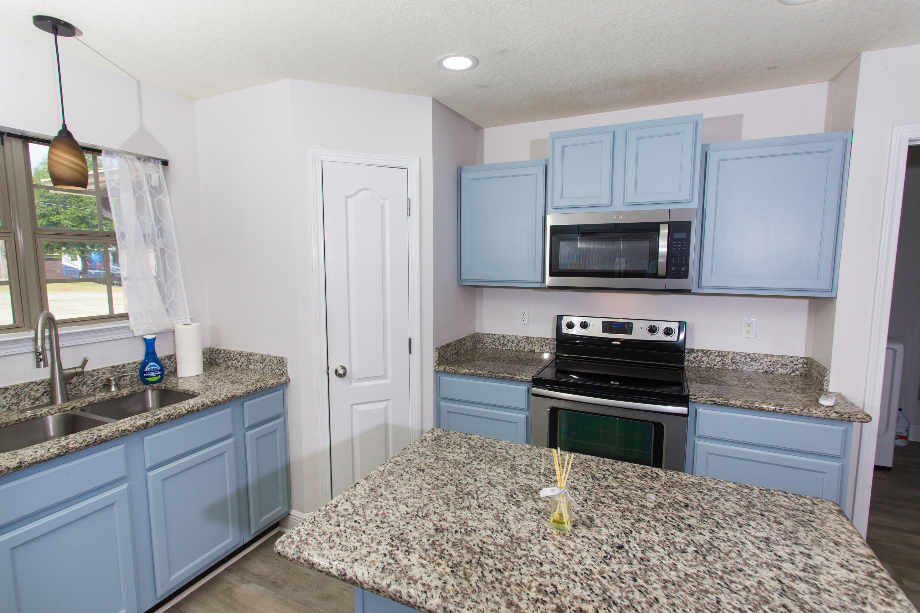6229 Flash Lane Crestview, FL 32536 - Photo 15 of 51 a kitchen with a stove a sink and a microwave