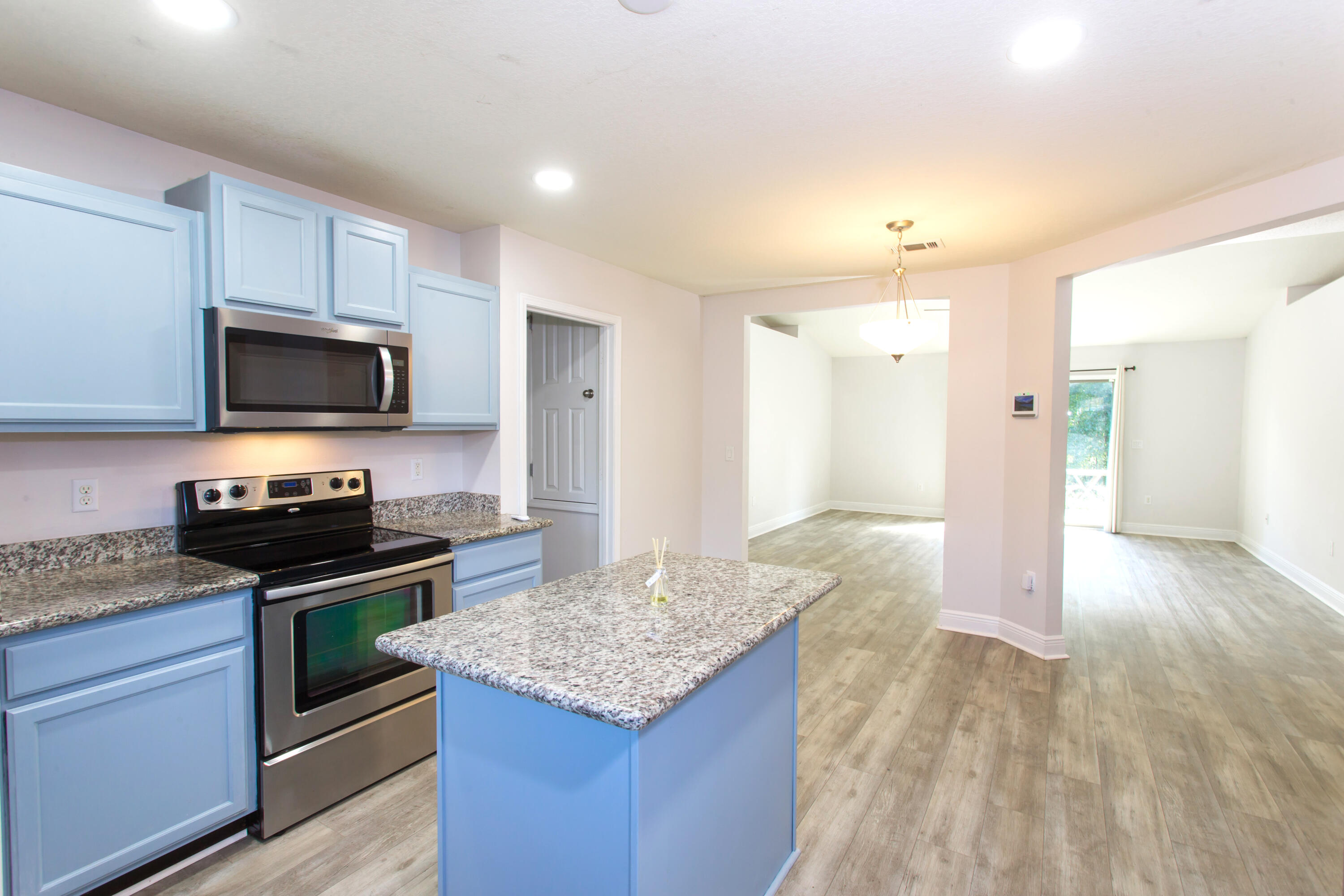 6229 Flash Lane Crestview, FL 32536 - Photo 17 of 51 a kitchen with granite countertop a stove and a sink