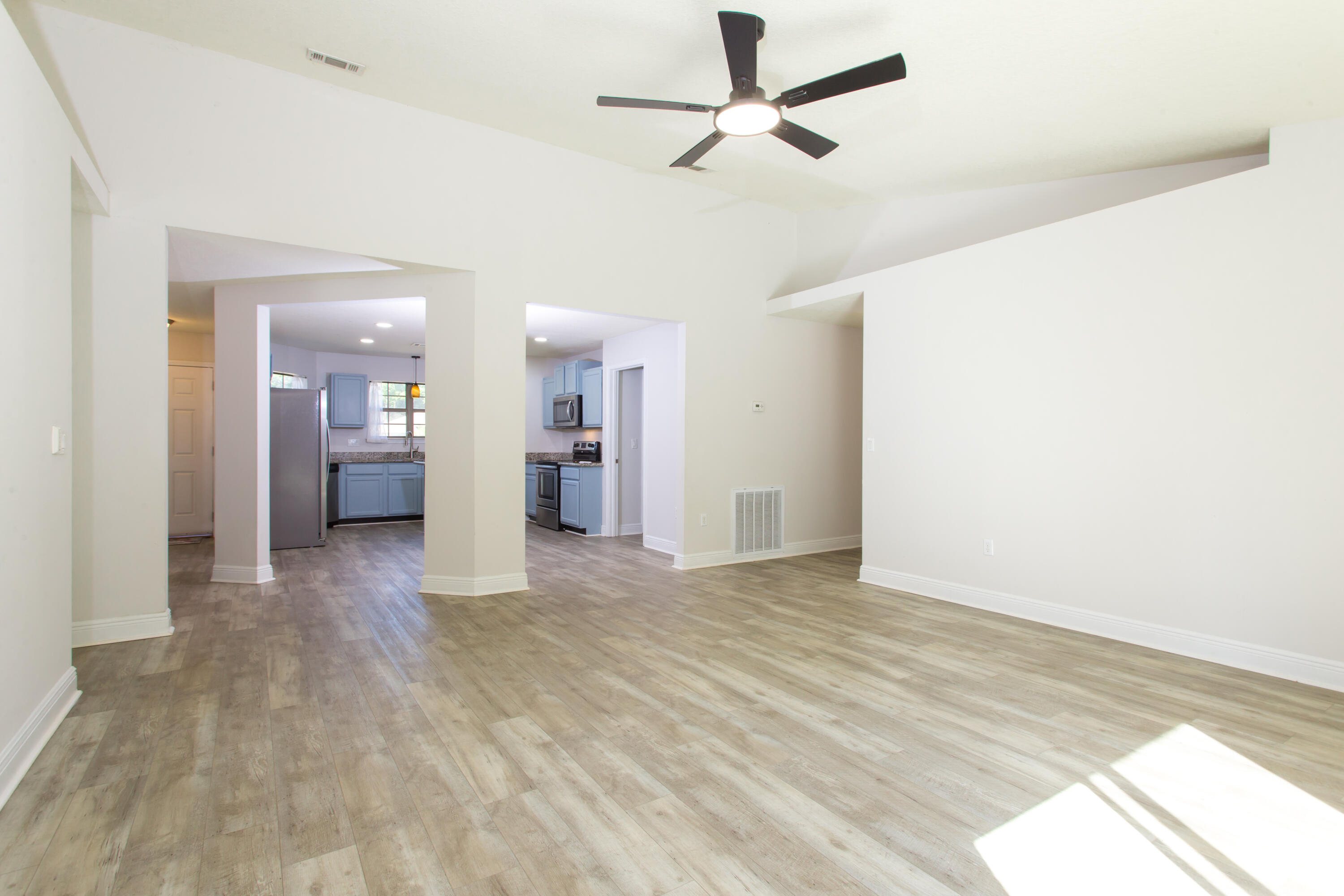 6229 Flash Lane Crestview, FL 32536 - Photo 18 of 51 a view of empty room with wooden floor and fan