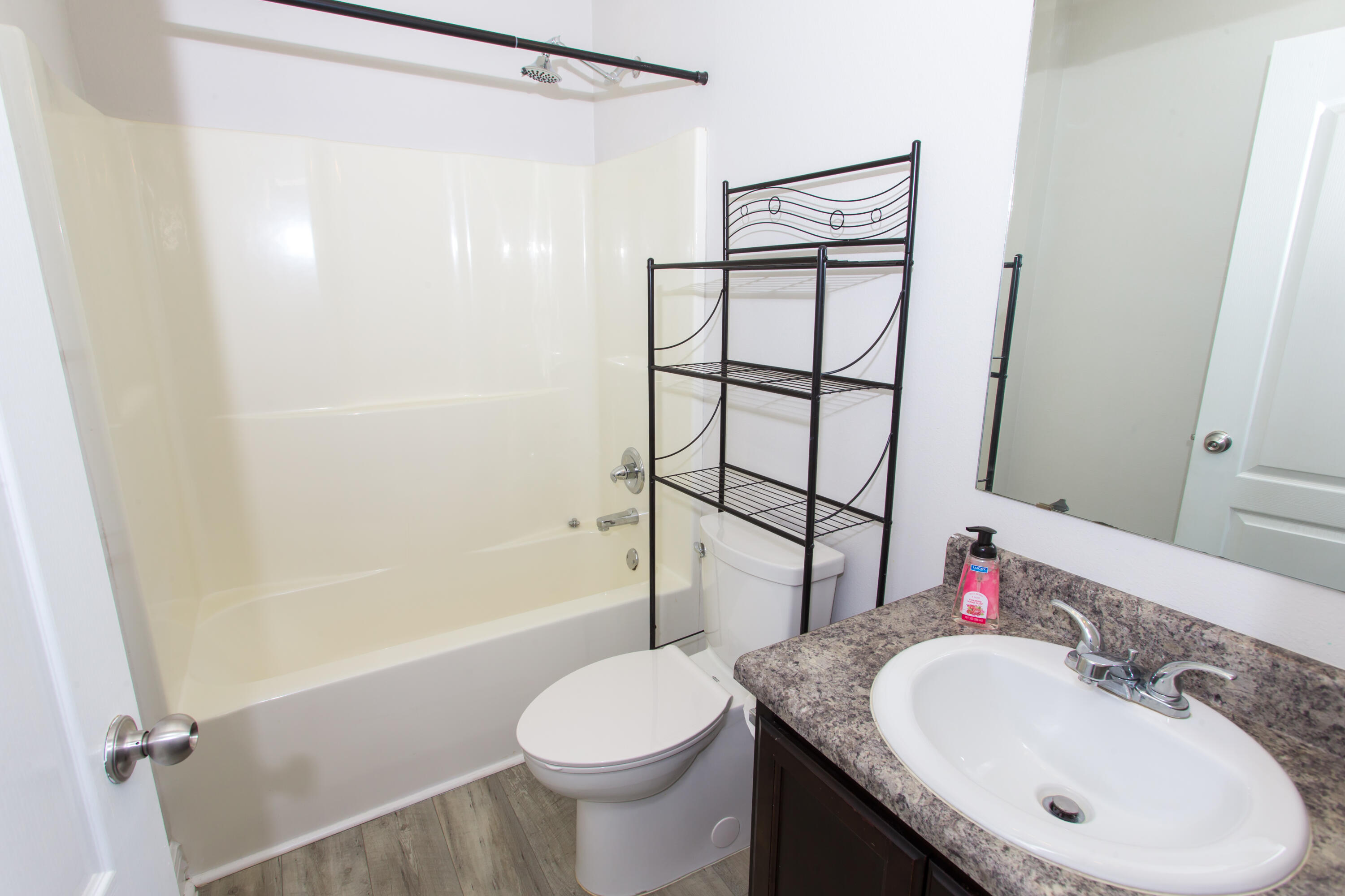 6229 Flash Lane Crestview, FL 32536 - Photo 29 of 51 a bathroom with a granite countertop sink toilet and shower