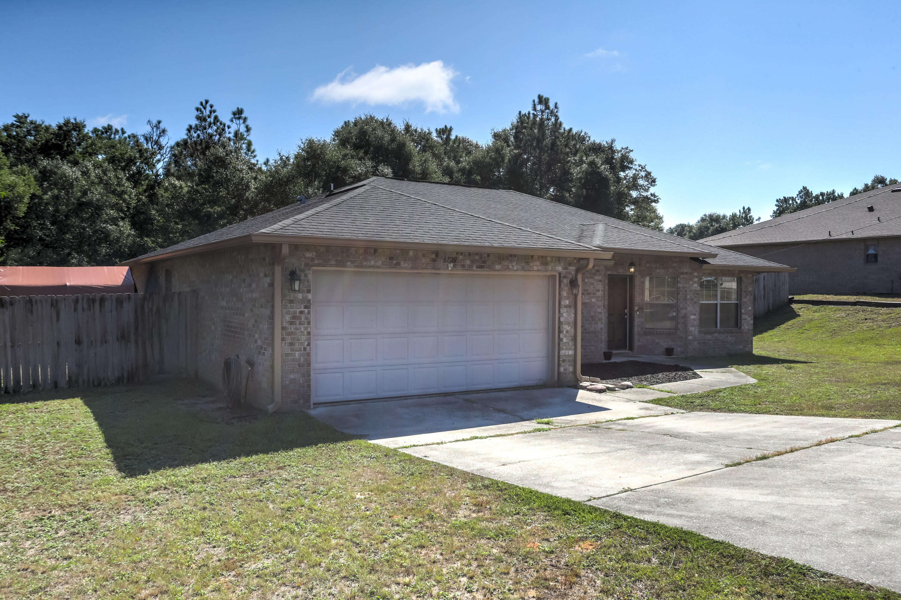 6229 Flash Lane Crestview, FL 32536 - Photo 3 of 51 a backyard of a house