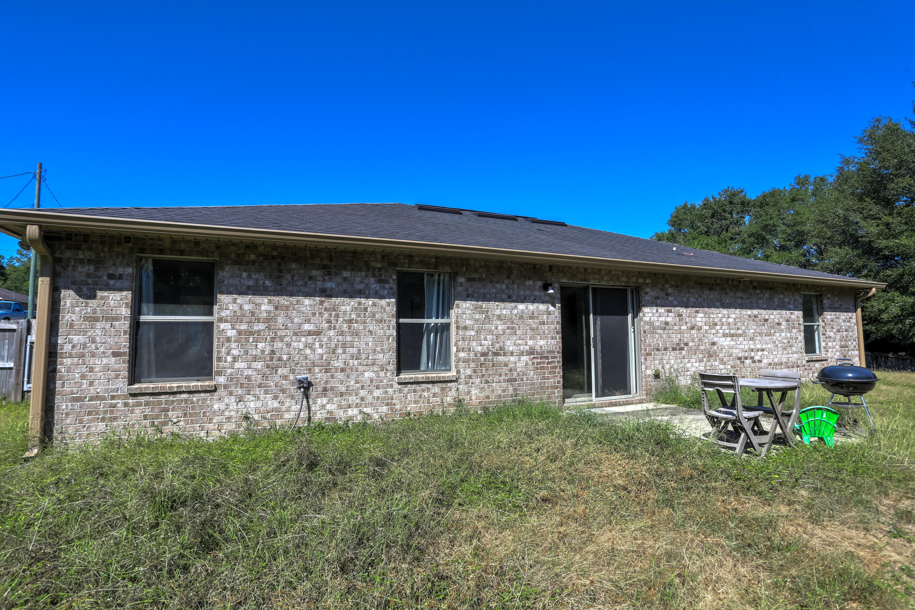 6229 Flash Lane Crestview, FL 32536 - Photo 37 of 51 a front view of a house with garden