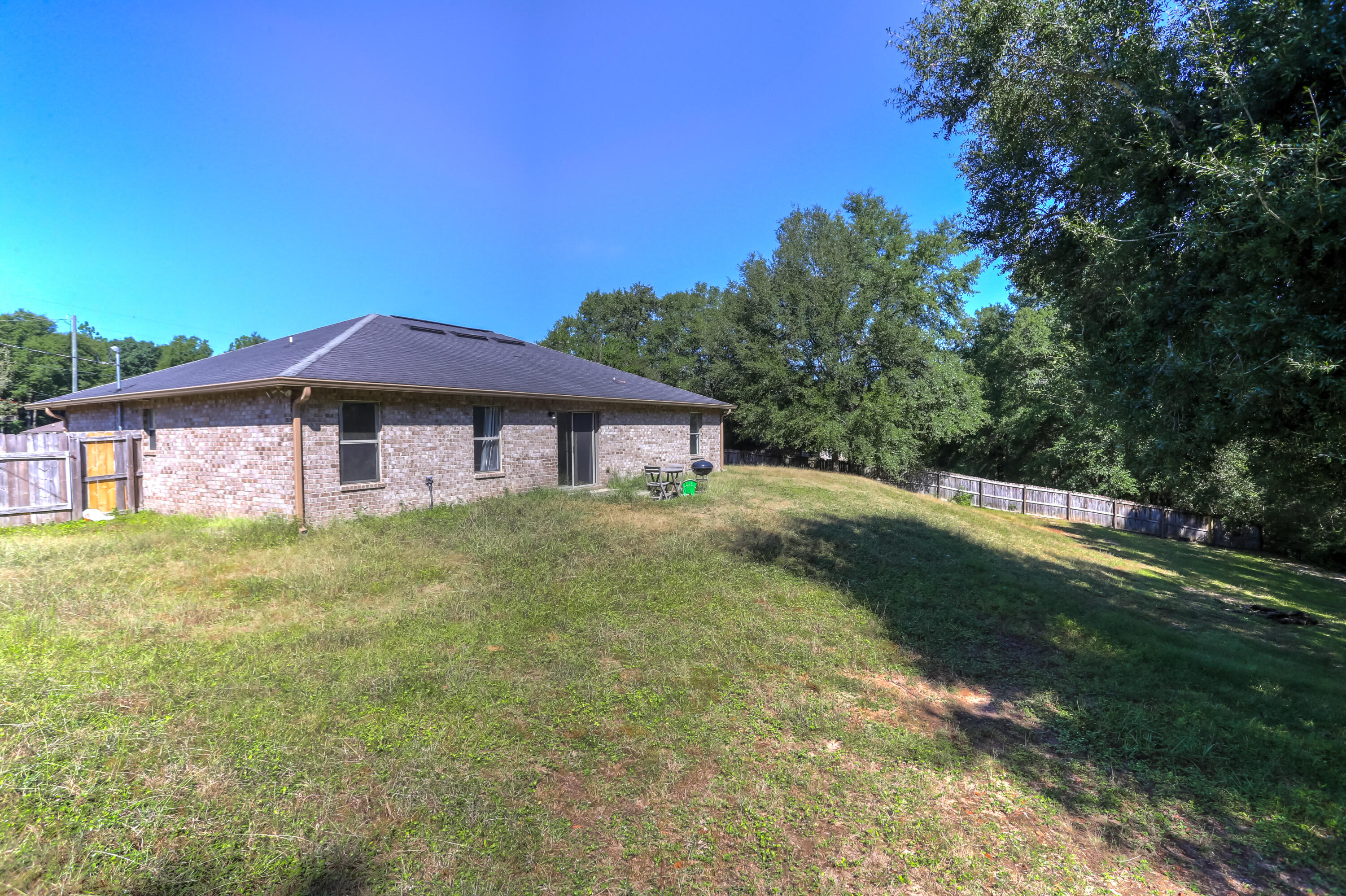 6229 Flash Lane Crestview, FL 32536 - Photo 38 of 51 a front view of a house with a yard